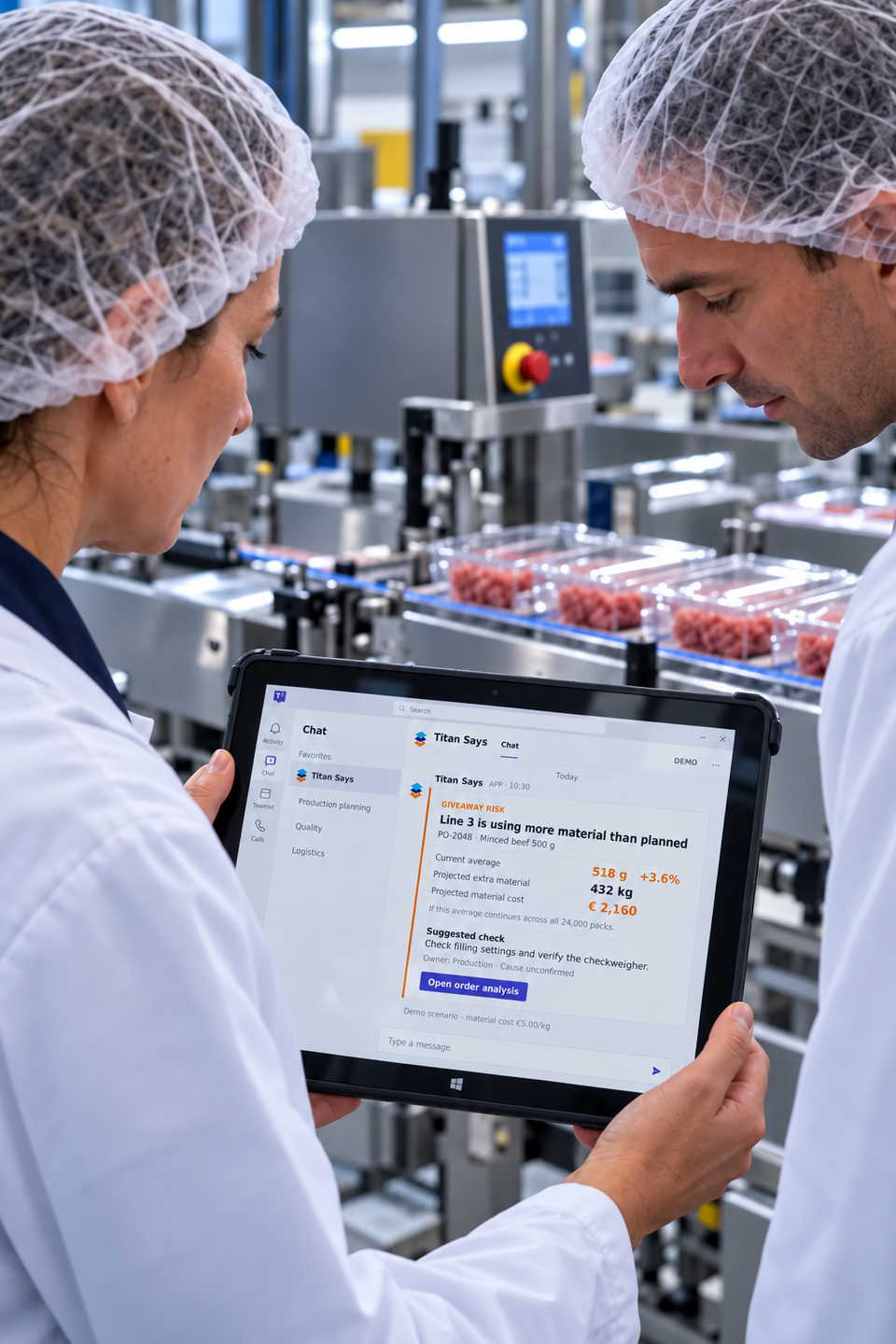 A production supervisor and operator review an amber Titan Says giveaway alert on a tablet beside a packaging line.